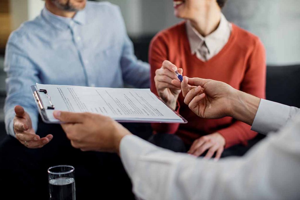 A Couple About To Sign a Real Estate Transaction