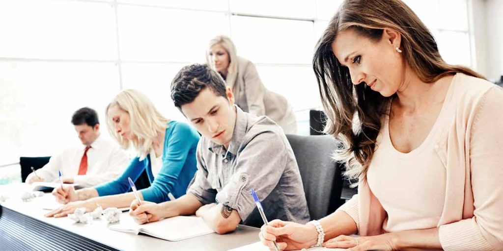 Multiple professionals enjoying the benefits of continuing education in real estate
