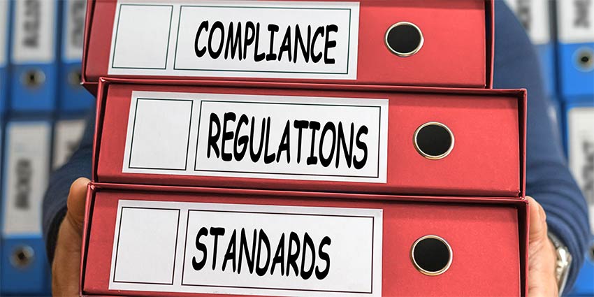 Three big folders about professional compliance, regulations, and standards. All subjects about what is the DBPR in Florida Real Estate and why it matters