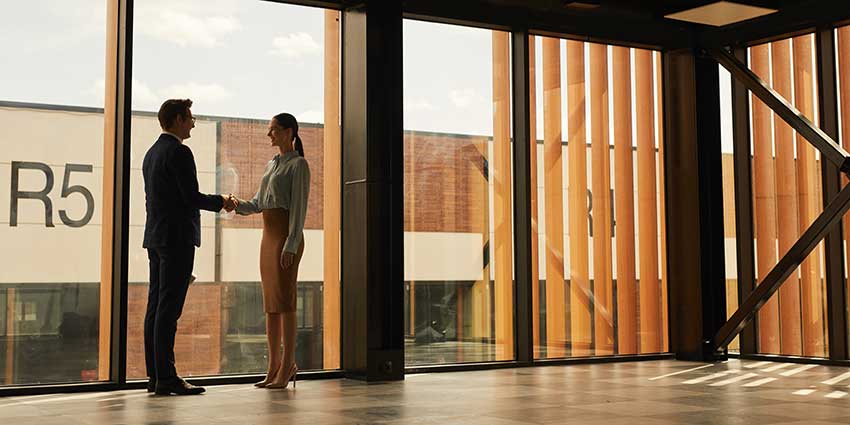 Two professionals talking about why Commercial Real Estate is a smart career move.